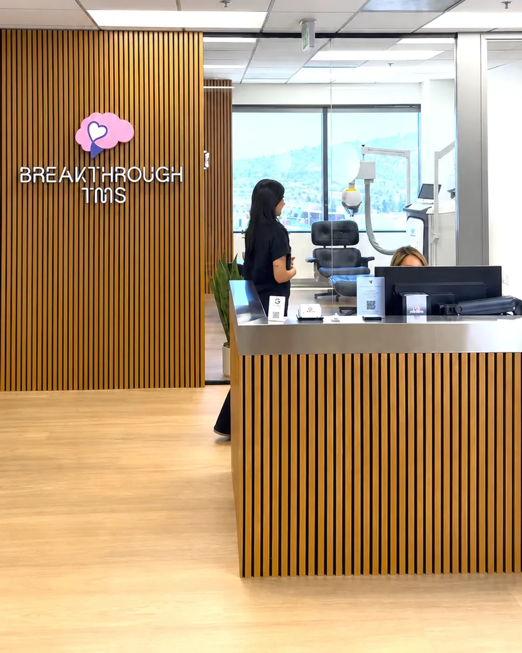 Breakthrough TMS reception desk with a team member in Glendale